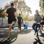 “함께 달리며 건강 챙기기, 러닝 크루로 시작해보세요!” man in black t-shirt and black shorts running on road during daytime